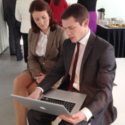 Peter Hughes demos the new CIM website to Claire Bradshaw Marketing Manager of Titanic Belfast.