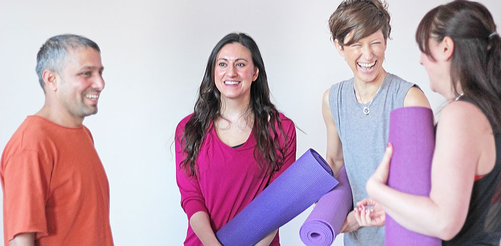 The Namaste Yoga Centre Belfast team enjoy a laugh before their session.